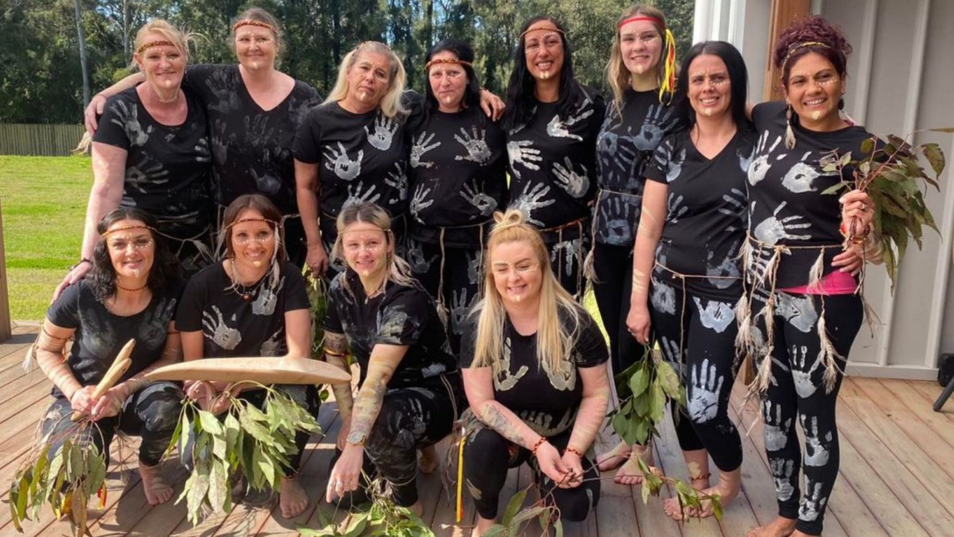women in indigenous face paint
