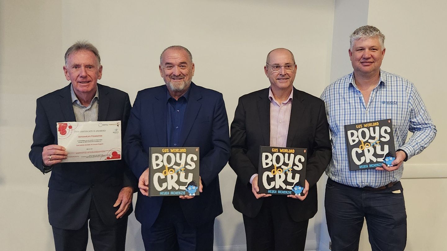 men holding story books