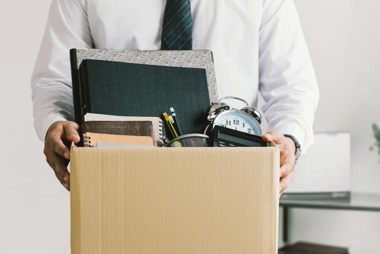 Man with box of belongings