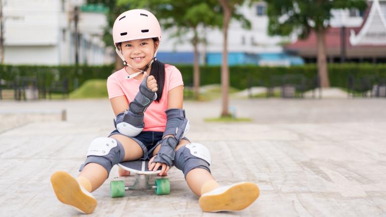 Girl with helmet & skateboard