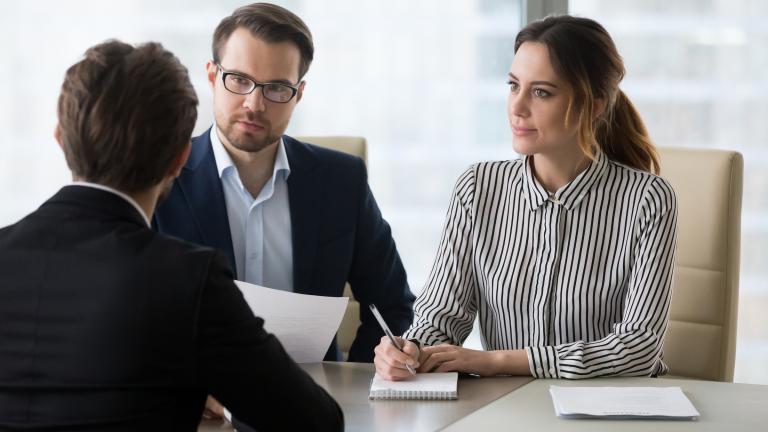 Couple sitting at desk