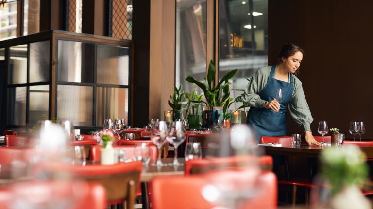 Waitress setting tables
