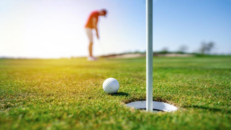Golfer on putting green
