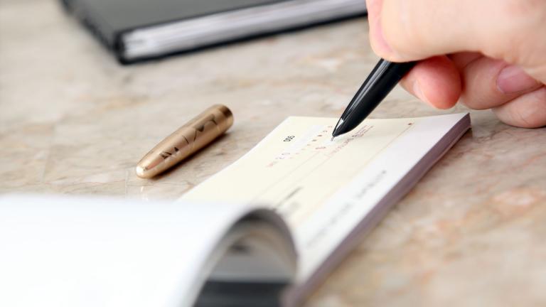 pen writing a cheque