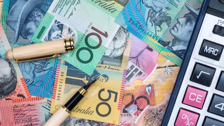 australian money, calculator and a pen