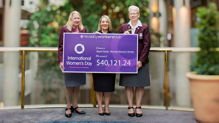 revesby workers workers holding a cheque