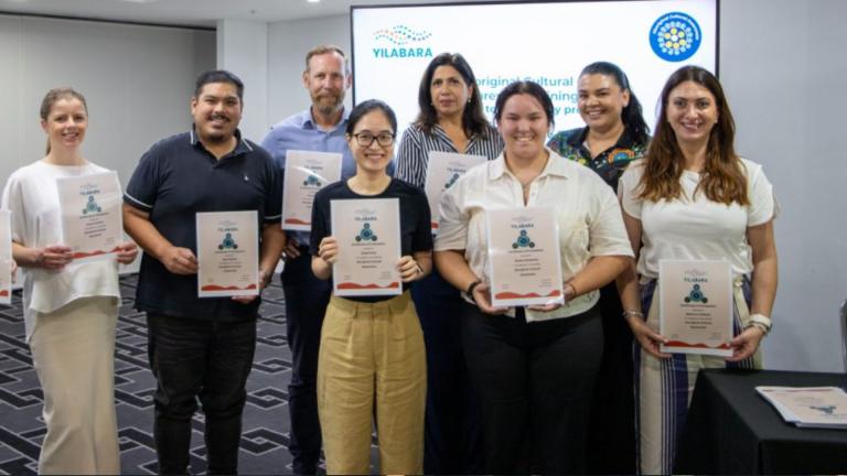 clubsnsw staff holding certificates