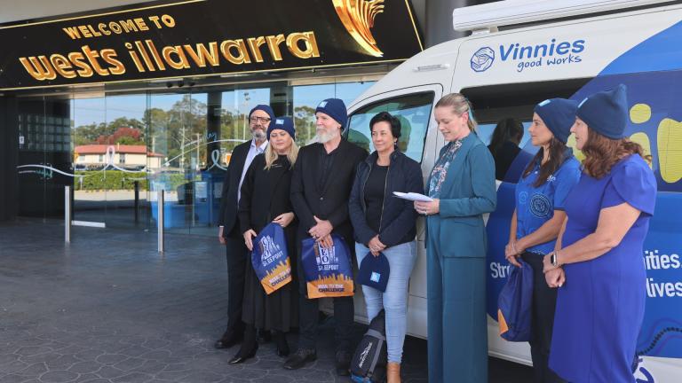 People standing in front of van