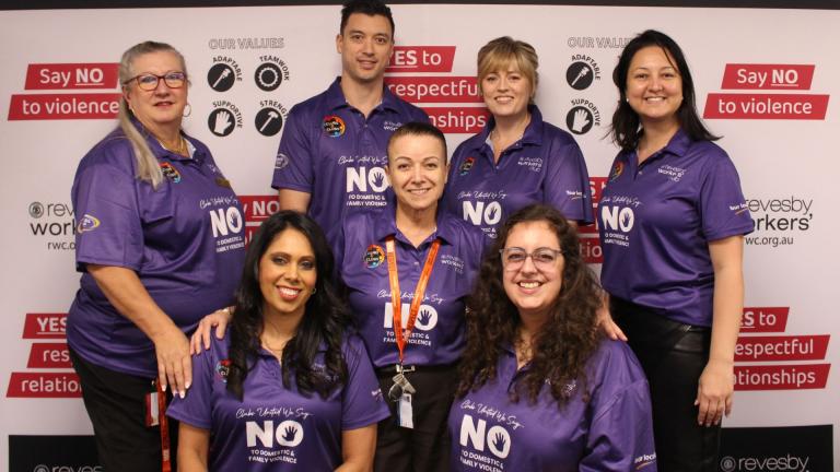 staff members wearing purple friday shirts