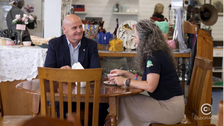 man and woman sitting at table