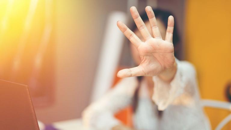 woman putting hand up