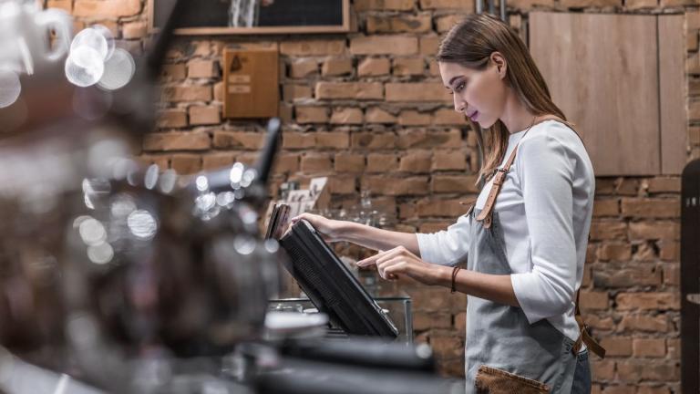 woman working behind the bar