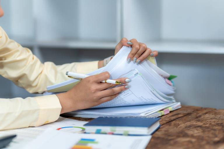 man going through papers