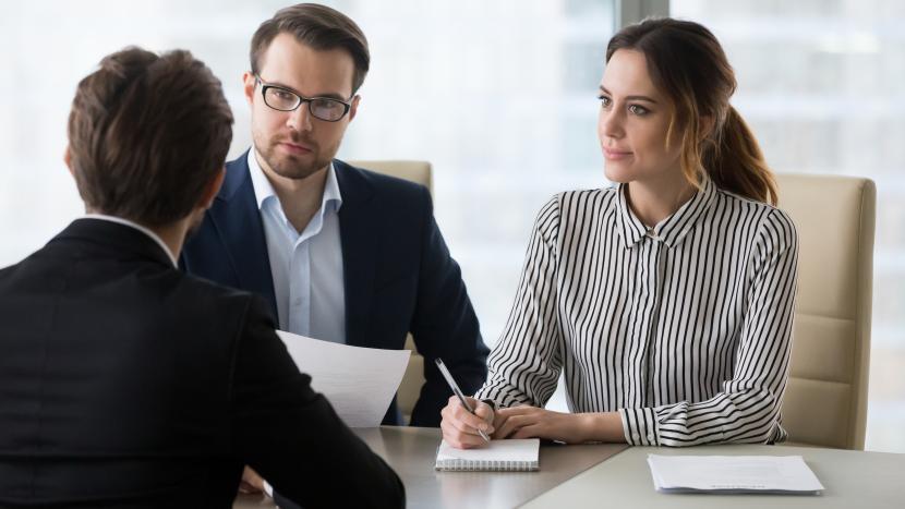 Couple sitting at desk
