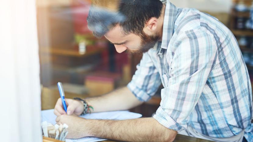 Man filling out paperwork