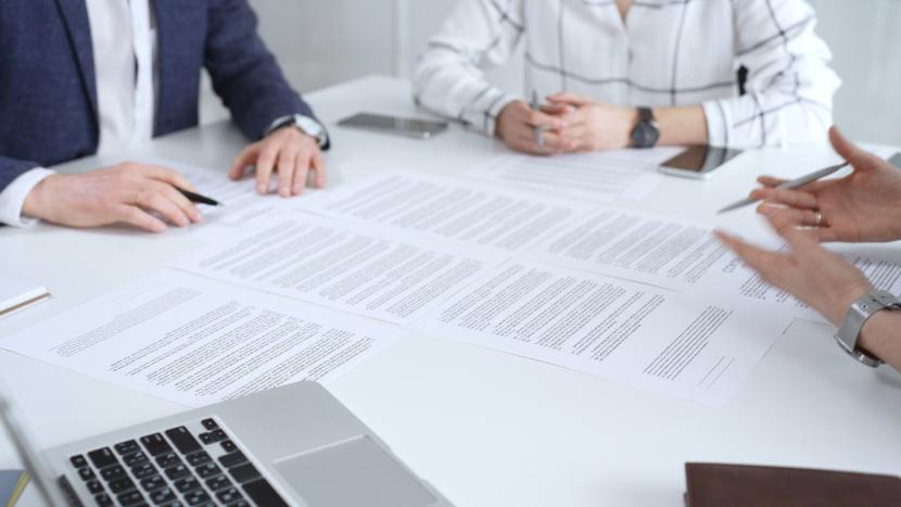 Businesspeople signing contracts